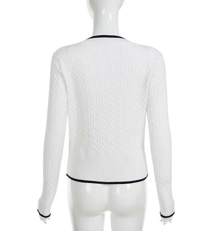 Long Sleeve VNeck Knit Top shown from the back, featuring a cable knit design and sleek silhouette.