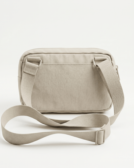 Onyx Crossbody Fit — three-quarter view showing the silhouette from the front-left angle in neutral